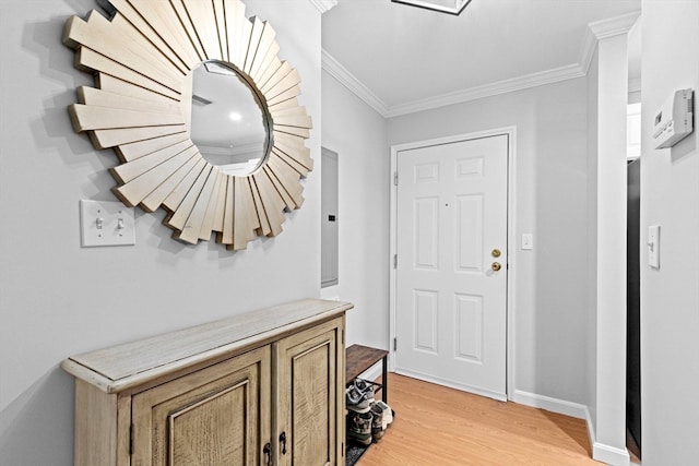 mudroom with ornamental molding and light hardwood / wood-style flooring