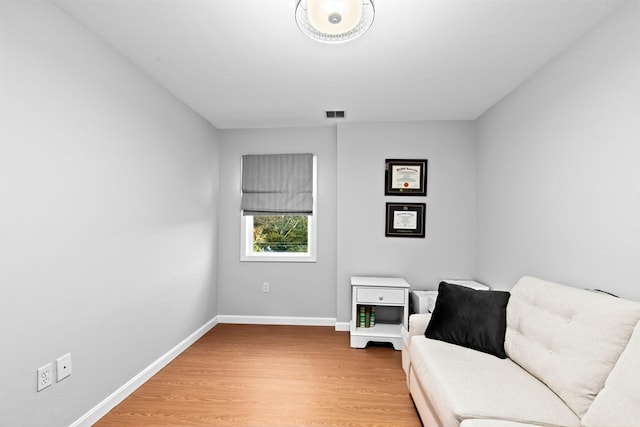 living area featuring hardwood / wood-style floors