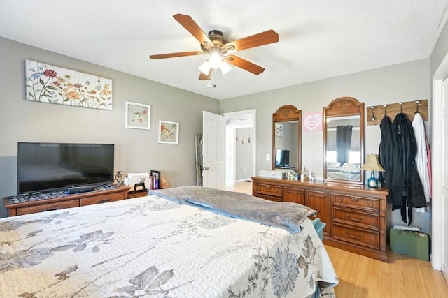 bedroom featuring a ceiling fan and light wood finished floors