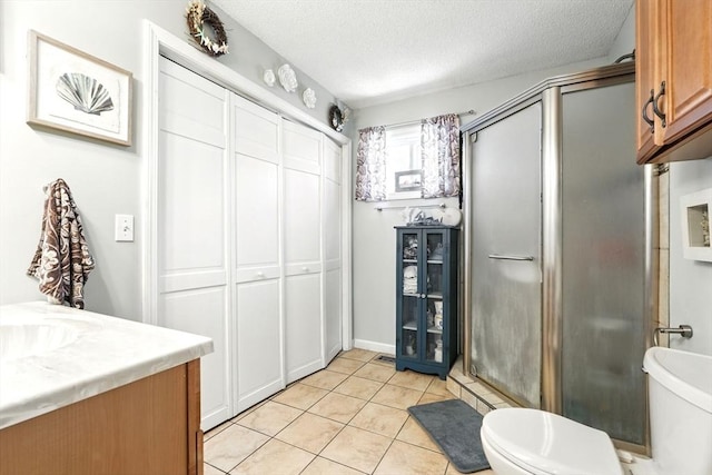 full bath with a textured ceiling, a shower stall, tile patterned flooring, and wine cooler