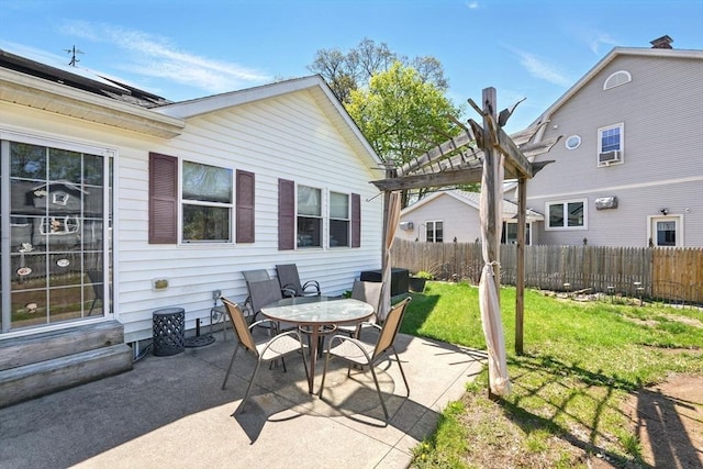 view of patio featuring fence and a pergola