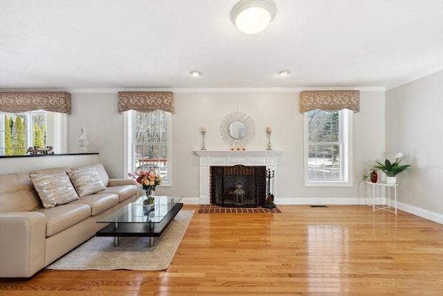 6 Hutchins Way, Westford, MA 01886 - living area featuring wood finished floors, crown molding, a brick fireplace, and baseboards