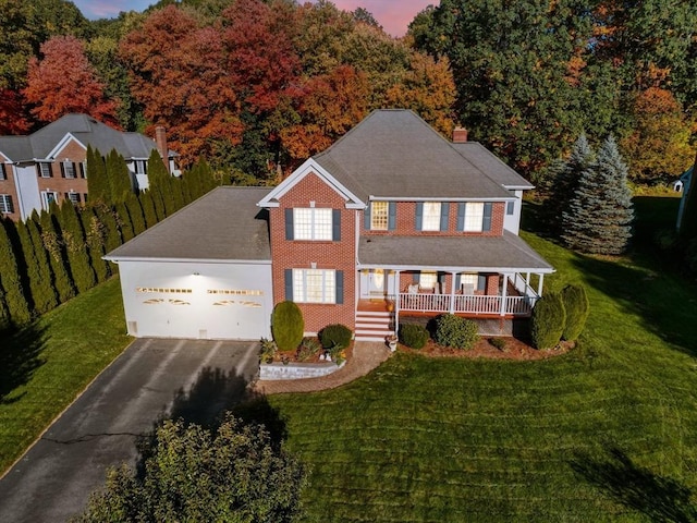 6 Hutchins Way, Westford, MA 01886 - view of front of home with covered porch, a garage, driveway, a front yard, and a chimney