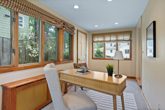 office space featuring recessed lighting, baseboards, and light carpet