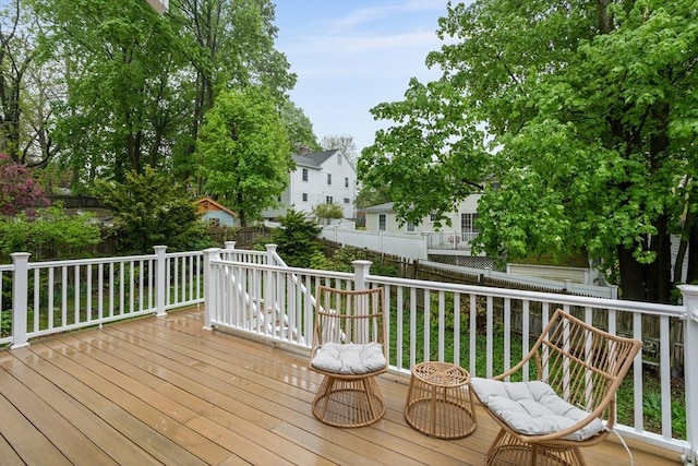 wooden terrace featuring a fenced backyard