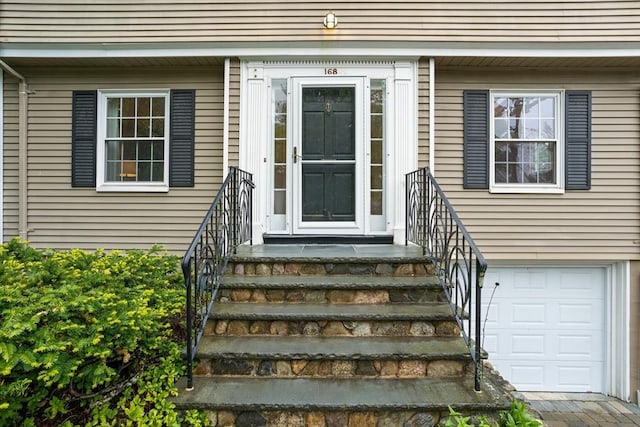 doorway to property featuring a garage