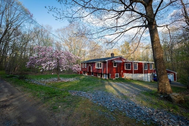8 Adams Rd, Hubbardston, MA 01452 - view of front of home featuring a chimney, driveway, an attached garage, and a front lawn