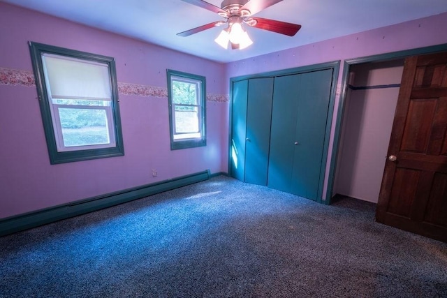 8 Adams Rd, Hubbardston, MA 01452 - unfurnished bedroom featuring a baseboard radiator, carpet, two closets, and a ceiling fan