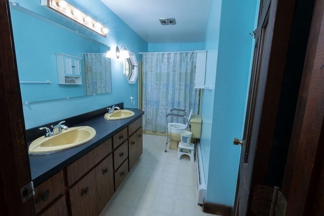 8 Adams Rd, Hubbardston, MA 01452 - full bath featuring tile patterned floors, double vanity, and curtained shower