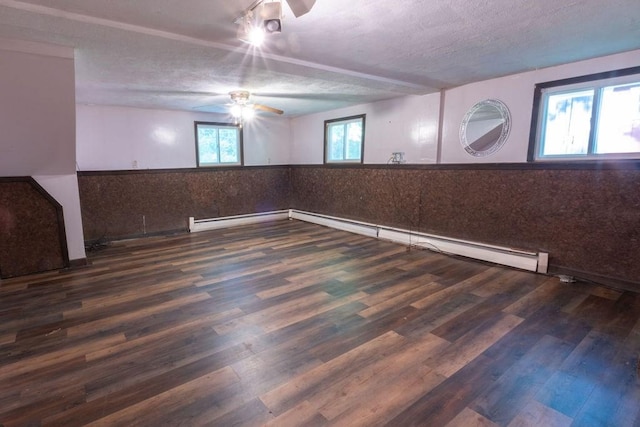 8 Adams Rd, Hubbardston, MA 01452 - empty room with ceiling fan, wainscoting, wood finished floors, a baseboard radiator, and a textured ceiling