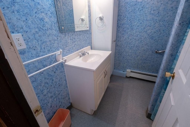 8 Adams Rd, Hubbardston, MA 01452 - bathroom with a baseboard heating unit, wallpapered walls, and vanity