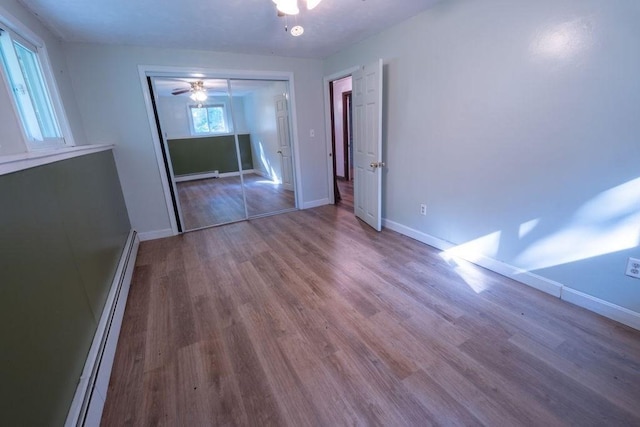 8 Adams Rd, Hubbardston, MA 01452 - unfurnished room with a baseboard radiator, wood finished floors, a baseboard heating unit, and a ceiling fan