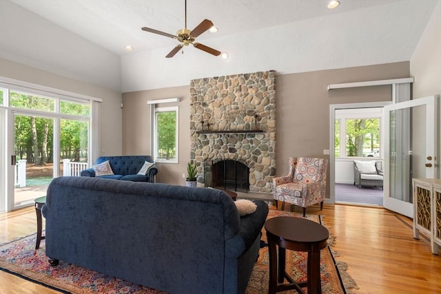 14 Sandpiper Hl, Sharon, MA 02067 - living area featuring lofted ceiling, light wood finished floors, ceiling fan, a stone fireplace, and recessed lighting