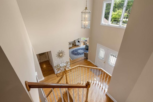 14 Sandpiper Hl, Sharon, MA 02067 - stairway with a high ceiling, wood finished floors, and a chandelier