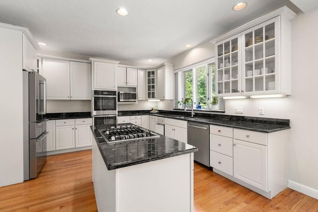 14 Sandpiper Hl, Sharon, MA 02067 - kitchen featuring stainless steel appliances, recessed lighting, light wood finished floors, white cabinetry, and a center island