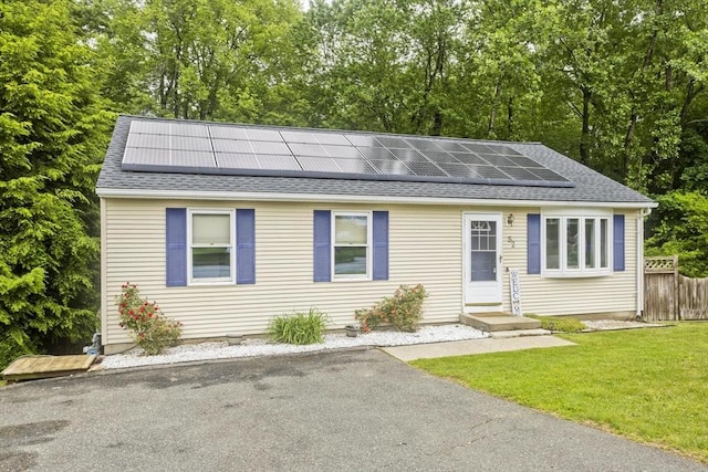 52 Marmon Ct, Springfield, MA 01129 - view of front of home featuring roof with shingles, roof mounted solar panels, and entry steps