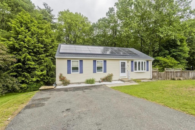 52 Marmon Ct, Springfield, MA 01129 - view of front of home with solar panels, roof with shingles, and entry steps