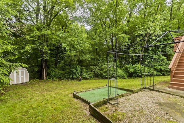 52 Marmon Ct, Springfield, MA 01129 - view of grassy yard featuring stairs and a wooded view