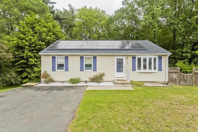 52 Marmon Ct, Springfield, MA 01129 - view of front of property with entry steps, solar panels, and roof with shingles
