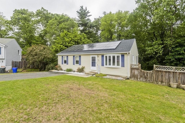 52 Marmon Ct, Springfield, MA 01129 - view of front of property with solar panels, entry steps, asphalt driveway, and view of scattered trees