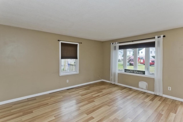 52 Marmon Ct, Springfield, MA 01129 - spare room featuring light wood-style flooring, healthy amount of natural light, and baseboards