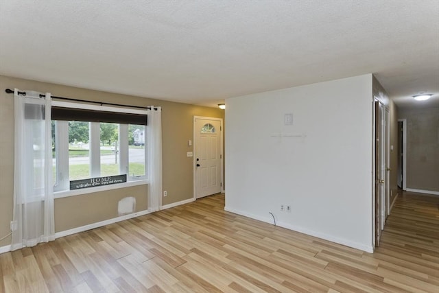 52 Marmon Ct, Springfield, MA 01129 - spare room with light wood-type flooring, a textured ceiling, and baseboards