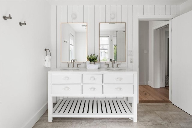 bathroom with tile patterned floors and vanity