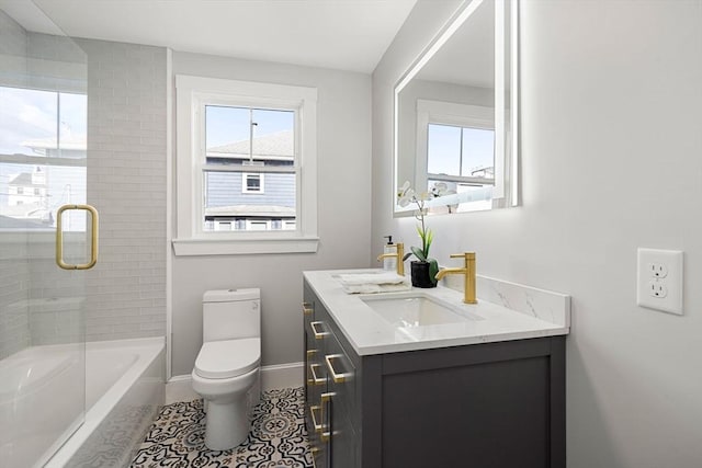 full bathroom with tiled shower / bath, vanity, toilet, and tile patterned flooring