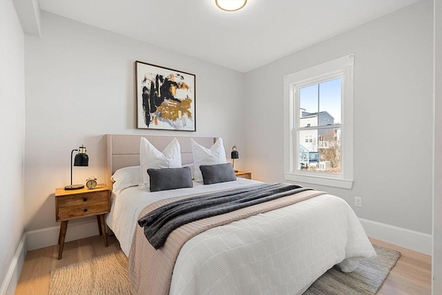 bedroom with light hardwood / wood-style floors