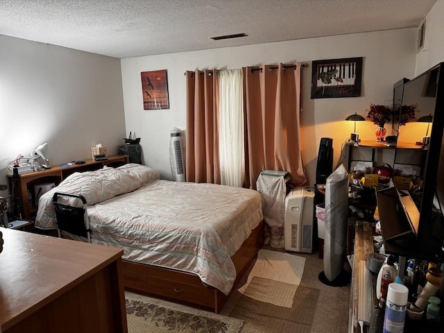 685 Oak St Unit 20-8, Brockton, MA 02301 - carpeted bedroom with a textured ceiling and visible vents