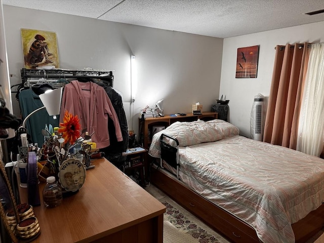 685 Oak St Unit 20-8, Brockton, MA 02301 - bedroom featuring a textured ceiling and visible vents