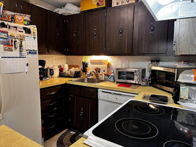 685 Oak St Unit 20-8, Brockton, MA 02301 - kitchen with light countertops, a toaster, white appliances, tasteful backsplash, and a sink