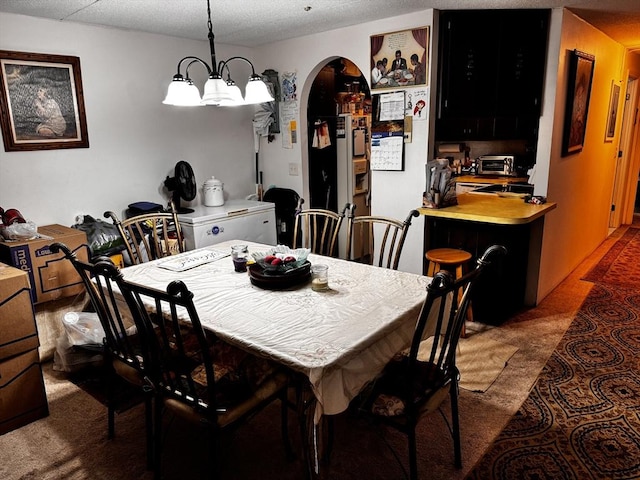 685 Oak St Unit 20-8, Brockton, MA 02301 - dining room featuring arched walkways, a toaster, and a textured ceiling