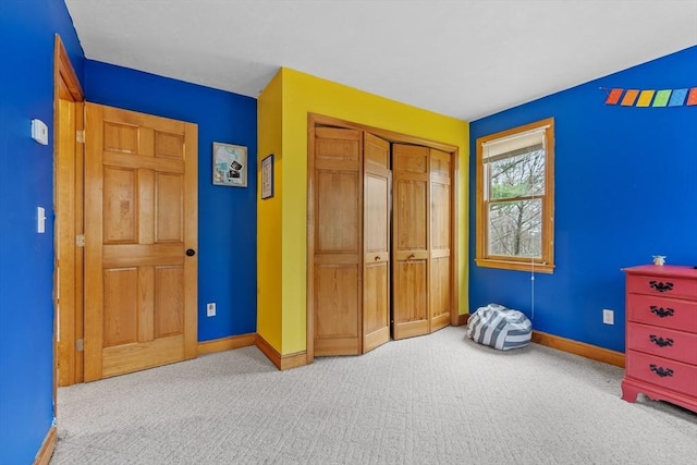 76 Woobly Rd, Bolton, MA 01740 - unfurnished bedroom featuring light carpet, baseboards, and a closet