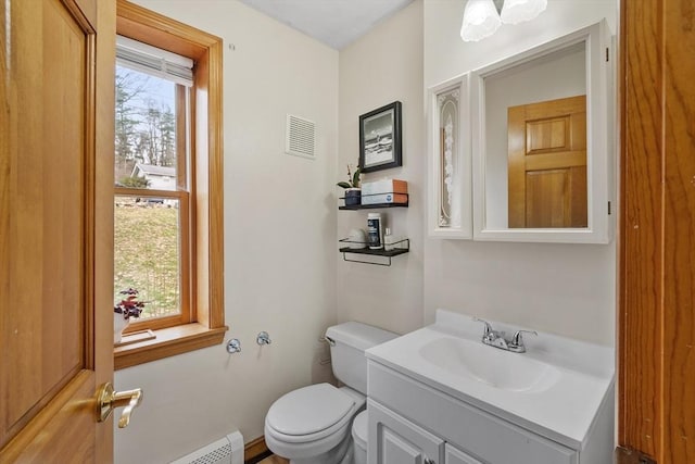 76 Woobly Rd, Bolton, MA 01740 - half bath featuring toilet, vanity, and a baseboard heating unit