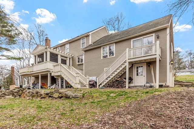 76 Woobly Rd, Bolton, MA 01740 - rear view of property featuring stairs, a sunroom, a chimney, and a deck