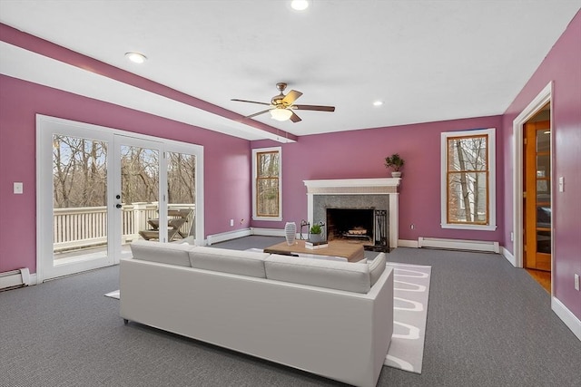 76 Woobly Rd, Bolton, MA 01740 - living area with a fireplace, a ceiling fan, baseboards, a baseboard radiator, and carpet flooring