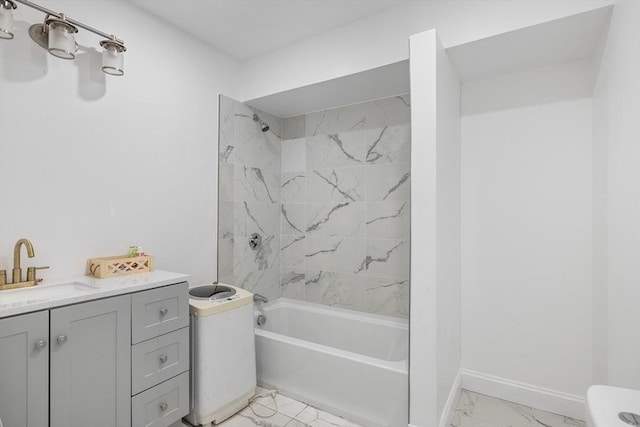 full bath featuring baseboards, toilet, shower / tub combination, marble finish floor, and vanity