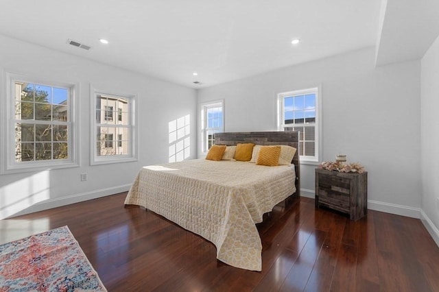 bedroom featuring recessed lighting, visible vents, baseboards, and hardwood / wood-style flooring