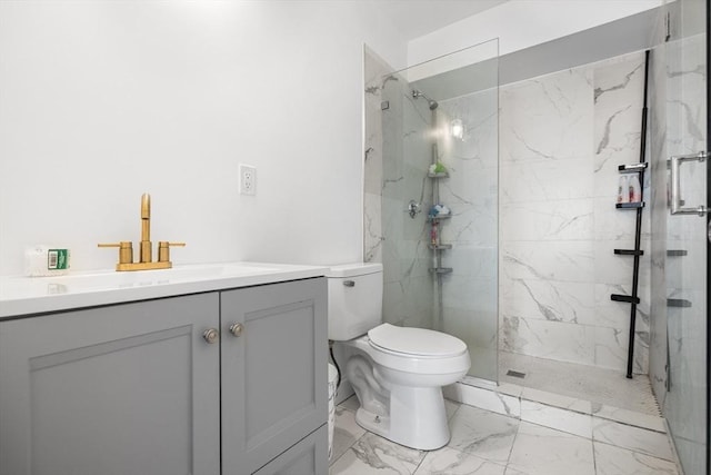 full bath with vanity, toilet, marble finish floor, and a marble finish shower