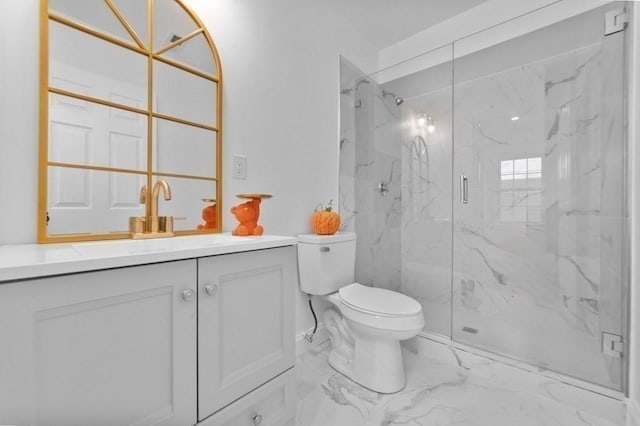 full bath featuring a marble finish shower, toilet, marble finish floor, and vanity