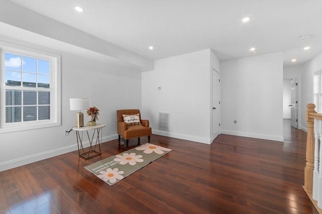 sitting room with visible vents, baseboards, recessed lighting, wood finished floors, and plenty of natural light