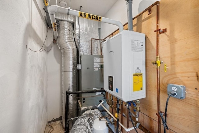 utility room with tankless water heater