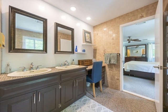 5 Deerfield Rd, Medway, MA 02053 - bathroom featuring tile walls, double vanity, connected bathroom, healthy amount of natural light, and a ceiling fan