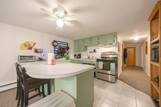5 Deerfield Rd, Medway, MA 02053 - kitchen with green cabinetry, stainless steel gas range, under cabinet range hood, a peninsula, and a sink