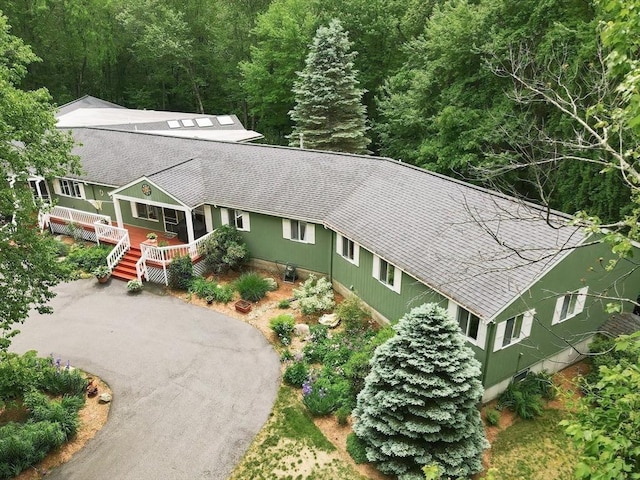 5 Deerfield Rd, Medway, MA 02053 - view of front of home with roof with shingles, a forest view, and a wooden deck