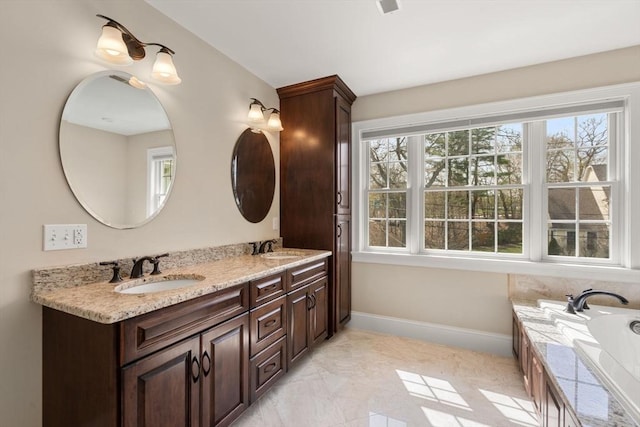 50 Sterling Rd, Needham, MA 02492 - full bath featuring double vanity, baseboards, and a tub