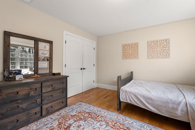 50 Sterling Rd, Needham, MA 02492 - bedroom featuring light wood finished floors, baseboards, and a closet