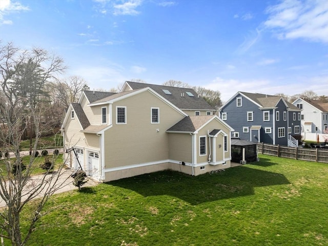 50 Sterling Rd, Needham, MA 02492 - back of property featuring a garage, a residential view, and a shingled roof