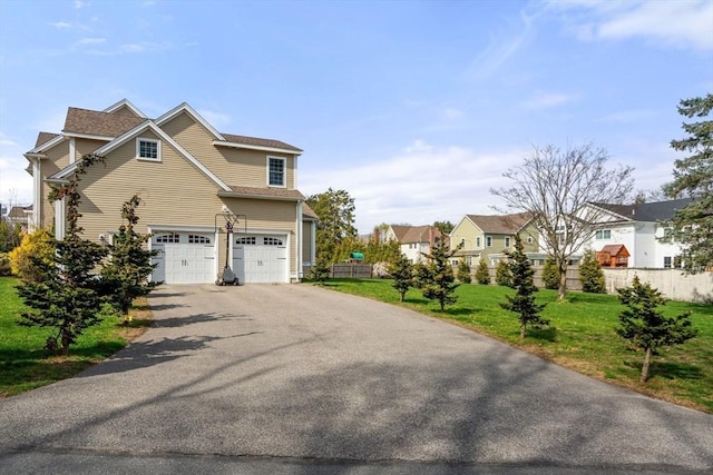 50 Sterling Rd, Needham, MA 02492 - view of property exterior with a garage, asphalt driveway, and a residential view